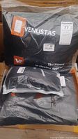 Three packaged items: Venustas heated jacket, CycHeat heated gloves, and Zodeel rain suit in plastic packaging.