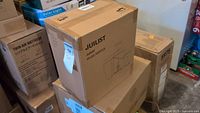Photo of boxed Juilist juicer model AMR526 among other boxes.