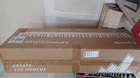 Closed cardboard box for Donner electronic keyboard piano showing branding and keyboard graphic.