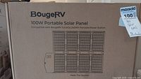 Box front showing BougeRV 100W Portable Solar Panel branding and compatibility details