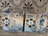 Two boxed collapsible water containers wrapped in plastic, showing front packaging and a white flexible spout on top.