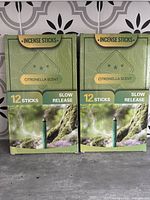 Two boxes of citronella incense sticks, each box containing 12 sticks with slow release formula for outdoor use.