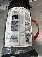 Photo of instruction label on bag illustrating steps to set up garden pond net, showing collapsible frame and securing methods.