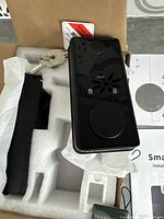 Top view of smart lock exterior unit showing fingerprint scanner, card sensor area, and keys.