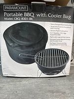 Front of box showing Paramount Portable BBQ with Cooler Bag, model CBQ-8301-BK, product image of BBQ and bag.
