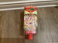 Front view of the Moldex SparkPlugs dispenser filled with colorful foam earplugs.