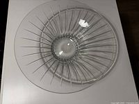 Top view photo showing the clear crystal bowl's circular shape and radial vertical cut pattern from center to rim.