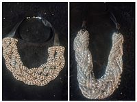 Both necklaces shown on black display fabric; left is gold tone rhinestone choker with black ribbon, right is silver-tone braided rhinestone necklace.