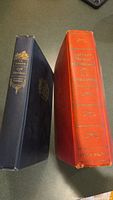 Spine view showing Lord Hornblower (dark blue cloth) and Captain Horatio Hornblower (orange-red cloth) books side by side.