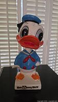 Front view of the Donald Duck nodder showing the sailor outfit and 'Walt Disney World' base lettering.
