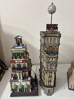 Front view of Paramount Hotel model with lit windows, awnings and entrance