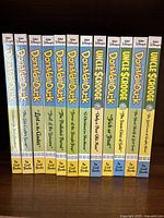 Full set of 12 hardcover volumes arranged side by side