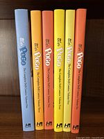 Spines of all six volumes lined up left to right