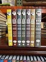 Spines of all seven hardcover volumes lined up on shelf, showing years 1931–1942.