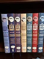 Seven hardcover books in The Complete Dick Tracy series with spines showing year ranges 1942-1953.