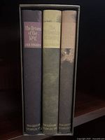 Three hardcover books The Return of the King, The Fellowship of the Ring, and The Two Towers in a slipcase, spines visible