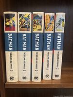 Spines of five hardcover omnibus volumes showing titles and volume numbers 6 to 10