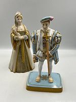 Two porcelain figurines: Edward VI front and Anne Boleyn standing behind, full-view