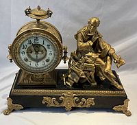 Front view of entire mantel clock and Shakespeare figure