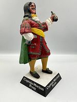 Side view of the Captain Morgan advertising figurine showing full body and base.