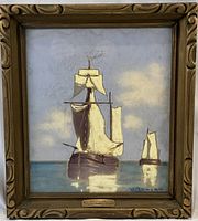 Front view of framed seascape painting titled “Dutch Fishing Boats”