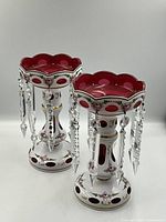 Both lustres side by side on white background showing matching design and scale.