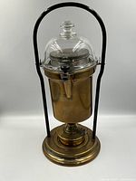 Assembled coffee percolator in black metal frame