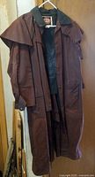 Full front view of the brown Australian oilskin outback coat showing shoulder cape and front pockets