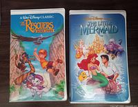 Two Disney Classic VHS tapes showing front covers: The Rescuers Down Under and The Little Mermaid.