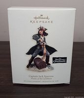 Box showing Hallmark Keepsake branding and image of Captain Jack Sparrow figurine ornament from Pirates of the Caribbean.