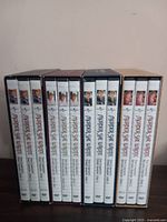 Photo showing the DVD spine cases for Murder She Wrote seasons 1 through 4, each labeled with episode titles and images of the main character.