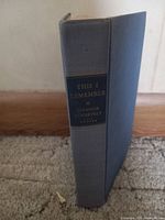 Spine of the book showing title 'This I Remember' by Eleanor Roosevelt, grey cloth cover with black and gold labeling.