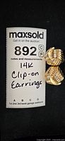 One clip-on earring next to MaxSold card reading '14K Clip-on Earrings'