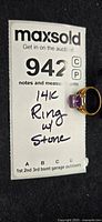 Ring on MaxSold card showing lot number