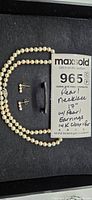 Lot layout showing pearl necklace and earrings with MaxSold tag