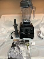 Full assembly: motor base, blending container with lid, tamper tool and recipe book