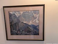 Front view of the framed print showing the mountainous landscape with rocky formations and snow peaks.