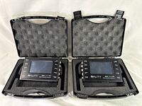Two 3ality 3FLEX SPC-7000 Stereo Platform Controllers in black protective cases with foam lining, each featuring LCD screen and labeled ports on front panel, displayed open on white background.