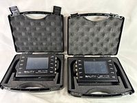 Two 3ality 3FLEX SPC-7000 stereo platform controllers placed inside protective foam-lined hard carrying cases.