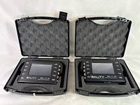 Photo showing two 3ality 3FLEX SPC-7000 Stereo Platform Controllers inside black carrying cases with foam padding.