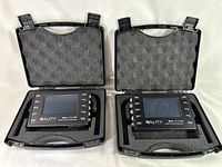 Two 3ality Digital 3Flex SPC 7000 Stereo Platform Controllers in open black cases with foam padding.