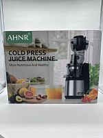 Front box showing AHNR branding and the juicer image with fruits and vegetables.