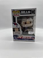Front view of boxed Funko Pop! Football Josh Allen #169 figure with clear window showing the figure inside featuring Josh Allen in Bills uniform and helmet.