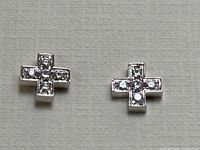 Front view of both earrings side by side on neutral background.