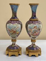 Pair of porcelain urns shown frontally