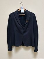Front view of black jacket-sweater hanging on hanger