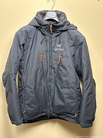 Front view of jacket hanging on hanger