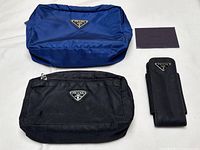 All items: blue makeup bag, black makeup bag, sunglass case, authenticity card