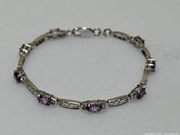 Full view of bracelet laid flat showing entire length and design.