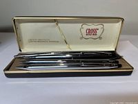 Four Cross writing instruments in original box, including gold-filled ballpoint pen